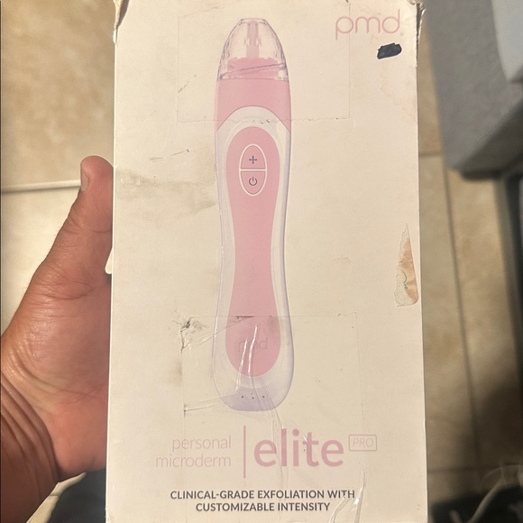 Open box. PMD Pink and White Skincare Device with Accessories - Picture 4 of 6